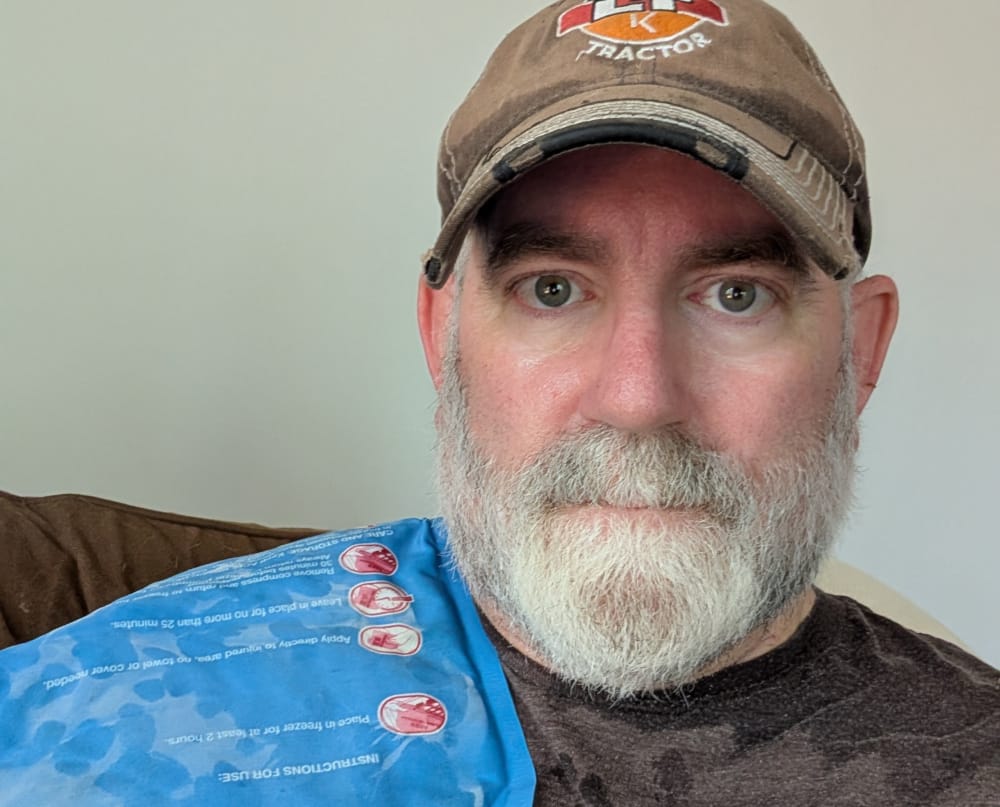 A sweaty Todd icing his shoulder.